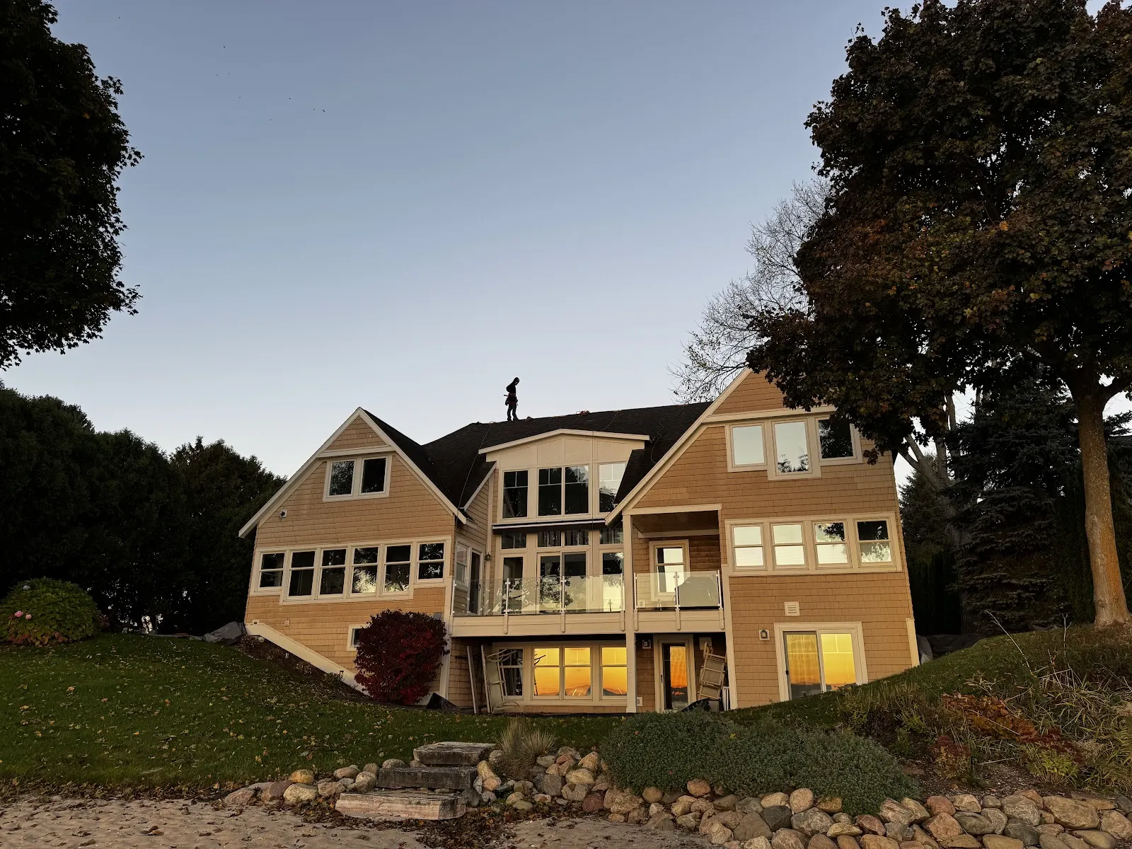 A well-maintained Northern Michigan home at dusk, ready for the change of seasons.