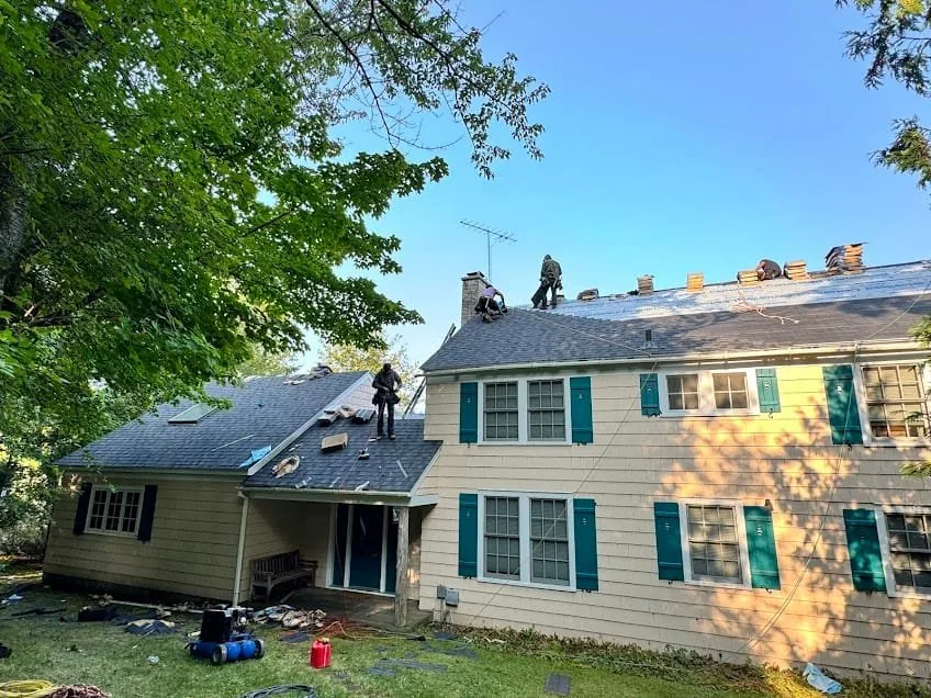 Falcon Roofing crew working on a residential roof in Traverse City